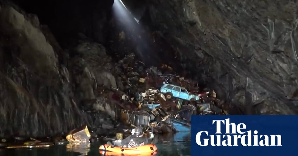 Welsh ‘car grave’ cave ‘at risk’ after social media boom – video report | UK news