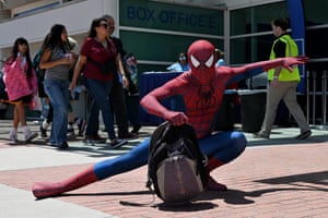 Spider-Man poses on the floor
