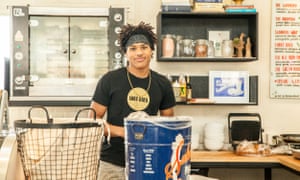 Vendor at Good Bird rotisserie chicken stall in New Orleans’ St Roch food market
