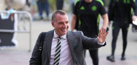 Brendan Rodgers waves to fans on his way into Celtic Park last night.