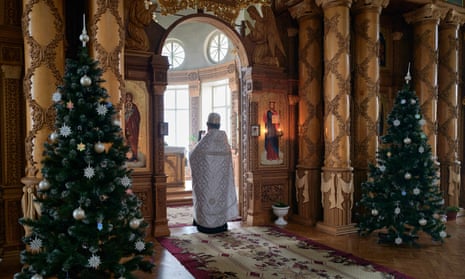 An Orthodox priest during a religious ceremony to mark the Orthodox Christmas in Kherson, Ukraine.