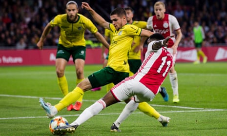 George Cox, on loan at Fortuna Sittard from Brighton, attempts to block a cross by Quincy Promes of Ajax in September.