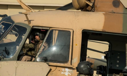 An Afghan air force Mi-17 helicopter pilot prepares to depart Kabul International airport in November 2014