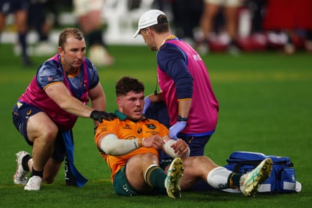 Carlo Tizzano receives medical attention at the MCG