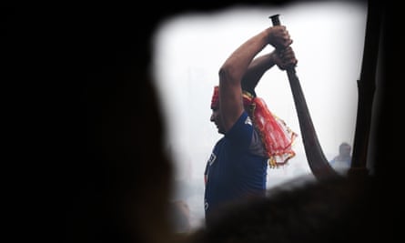 A Hindu devotee slaughters a buffalo as an offering during the Gadhimai festival.