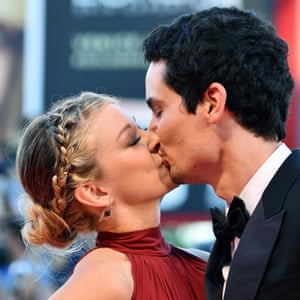 La La Land director, Damien Chazelle kisses his girlfriend before screening of his film