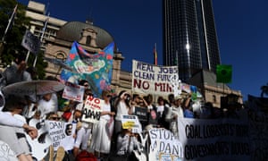 Environmental activists gather outside Parliament House in Brisbane to voice their opposition to Adani’s proposed Carmichael coalmine.