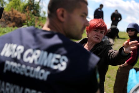 Investigators on the outskirts of Kharkiv in May.