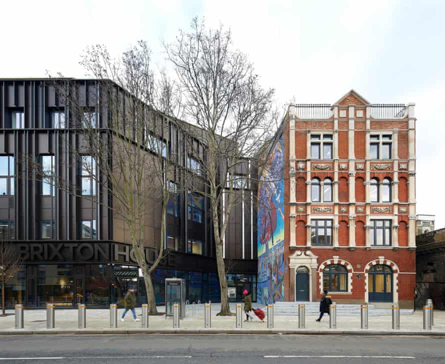 Brixton House alongside its neighbouring Carlton Mansions, whose mural Nuclear Dawn is painted the full height of the side wall.