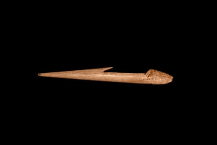 A primitive hunting tool against a black backdrop