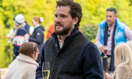 Man holding champagne glass in outdoor party