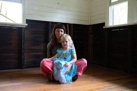Gemma Martin with her daughter Rune in their home in Murwillumbah, which flooded in February 2022.
