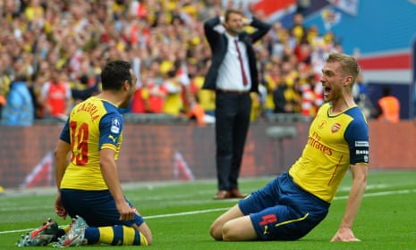 Mertesacker celebrates with Santi Cazorla whilst Villa boss Tim Sherwood can only put his head in his hands.