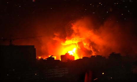 Flames and smoke rise from an Israeli airstrike in Dahiyeh, southern Beirut, early on Sunday.