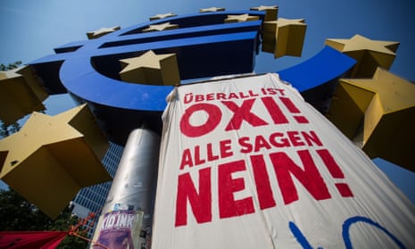 A banner urging a no vote in Sunday’s referendum in Greece hangs from a euro sign monument in front of the former European Central Bank headquarters in Frankfurt.