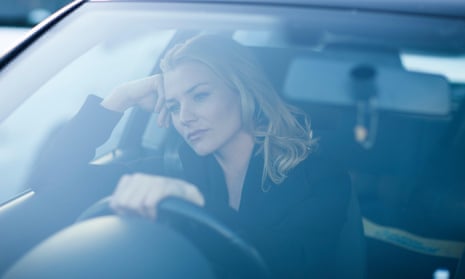 A woman driving alone.