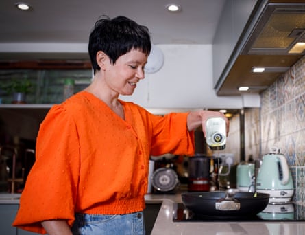 Rachel pour extra virgin olive oil into a frying pan.