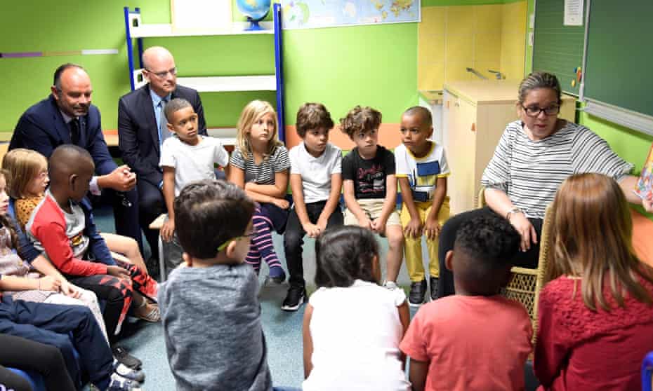 Pupils in France last September on their first day of the school year, sitting alongside the French prime minister, Édouard Philippe (left) and beside him the education minister, Jean-Michel Blanquer.
