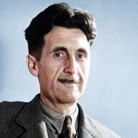 George Orwell, with a moustache and in a shirt, jacket and tie, smiles slightly