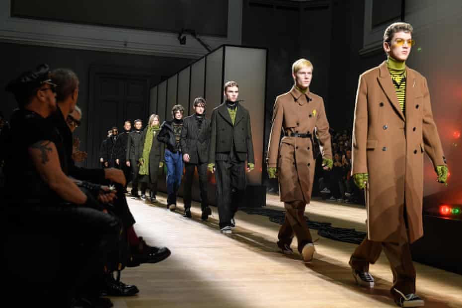 Models walk the runway during the finale of the Dior Homme menswear show in Paris.