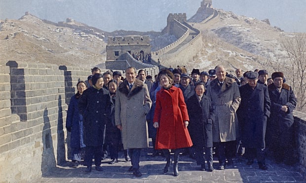 Richard Nixon and then-first lady Pat Nixon lead the way as they tour China’s Great Wall near Beijing during the 1972 visit