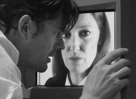 Sam Riley looks at a screen close-up of Alexandra Maria Lara in Bulk.