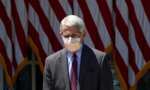 Dr. Fauci listens to President Trump speaking at the White House in Washington, May 15, 2020.