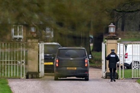 Police vehicles parked outside Royal Lodge.