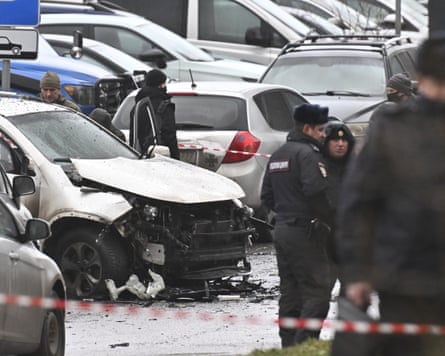 Investigators at the scene where Lt Gen Fanil Sarvarov was killed by a car bomb