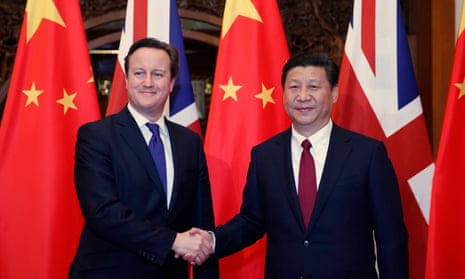 China’s Xi Jinping shakes hands with David Cameron