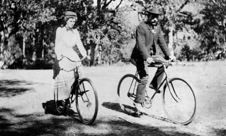 Couple riding bicycles, late 1890s. 