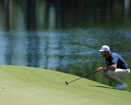 Sam Burns of nan US lines up a putt connected nan 16th greenish during information 1 of nan 2026 Masters.