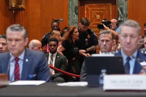 A protester is removed as US defence secretary Pete Hegseth began his opening speech at a Senate appropriations defence subcommittee hearing.