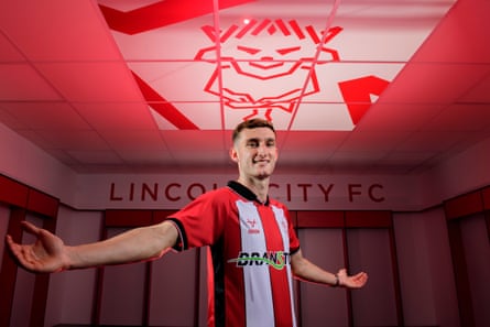 Lincoln City unveil new loan signing Mason Melia at ProAmpac Stadium.
