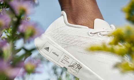 Shown is the Allbirds white sneaker collaboration with Adidas, showing a label with its carbon footprint.