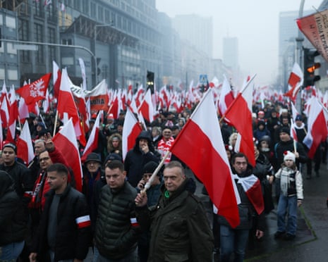 People attend a march to mark the 107th anniversary of Polish independence, in Warsaw, Poland.