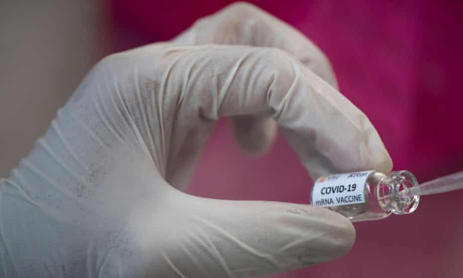 a lab worker testing for a coronavirus vaccine