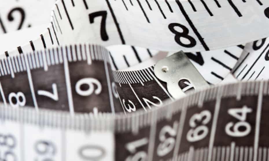 Measuring tape, symbol of tailoring and diets.