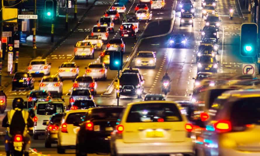 queue of cars in traffic jam at night
