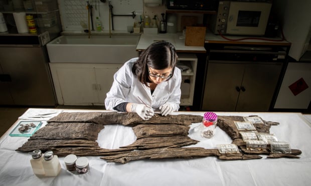 Conservator Luisa Duarte working on the 12th-century toilet seat
