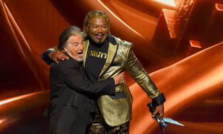 Christopher Judge hugs Al Pacino at the Game awards in Los Angeles.