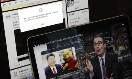 A screen shows a failure message saying a post could not be sent because ‘the content contains information that violates relevant laws and regulations’ on Sina Weibo next to a smaller computer screen showing a Last Week Tonight host John Oliver with a photo of Chinese President Xi Jinping and Winnie the Pooh.