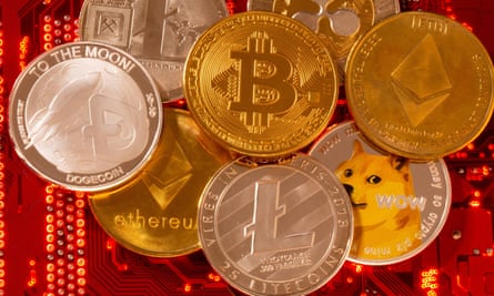 Representations of cryptocurrencies Bitcoin, Ethereum, DogeCoin, Ripple, Litecoin are placed on PC motherboard