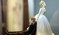 Bride and groom statuetes for a wedding cake top<br>Mandatory Credit: Photo by Sari Gustafsson / Rex Features ( 633293b )
 A wedding cake top with a bride dragging the groom
 Bride and groom statuetes for a wedding cake top
 
