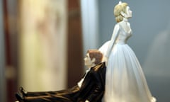 Bride and groom statuetes for a wedding cake top<br>Mandatory Credit: Photo by Sari Gustafsson / Rex Features ( 633293b )
 A wedding cake top with a bride dragging the groom
 Bride and groom statuetes for a wedding cake top
 