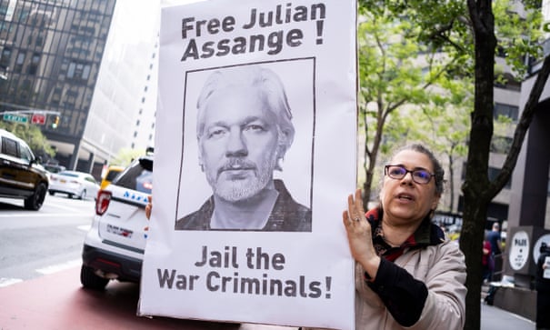 A woman protests in New York against Julian Assange's prison detention in the UK.