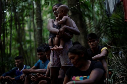 A family of Indigenous people in the rainforest
