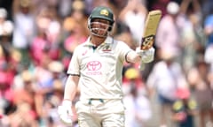 David Warner raises his bat after making a half-century for Australia against Pakistan on day four of the third Test