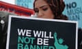 A woman in a hijab with a 'We will not be banned' sign