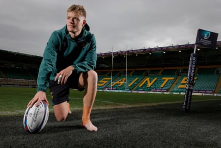 Fin Smith with a rugby ball